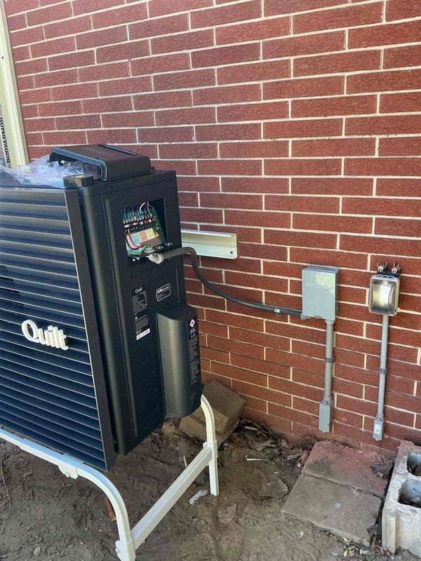 Completed installation of ductless mini-split system including outdoor condenser unit placement on prepared pad against exterior brick wall. Installed and wired electrical disconnect panel with proper conduit routing to support system operation. Coordinated work sequence to ensure electrical infrastructure was finalized prior to completing system commissioning and startup procedures.