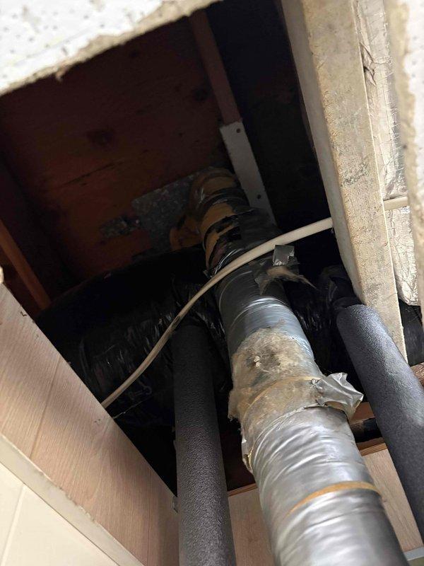Responded to service call for water heater with pilot light that would not remain lit. Upon inspection, accessed unit installed in ceiling chase between floor joists. Diagnosed failed thermocouple as root cause of pilot outage. Replaced defective thermocouple with new component, tested pilot light operation, and verified proper flame sensing and gas valve function. Unit restored to normal operation with pilot remaining lit and main burner cycling properly.