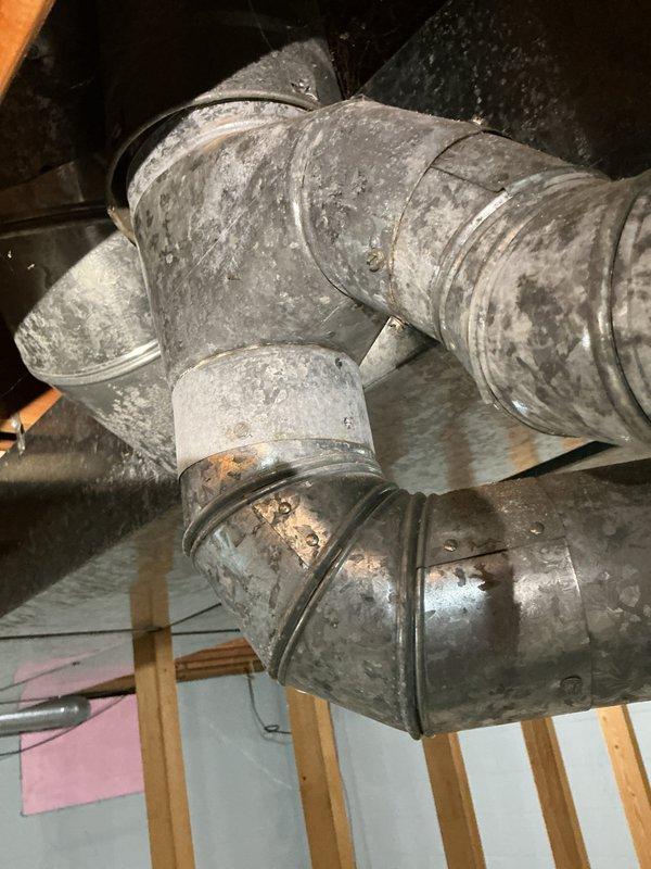 Completed comprehensive furnace super tune-up in basement mechanical room, including full system inspection, filter check, and performance verification of gray HVAC unit and associated ductwork. Inspected attic ductwork system showing normal wear patterns and confirmed all connections secure at junction points. Provided water heater assessment for equipment of unknown age and documented all mechanical systems with photos for customer records.