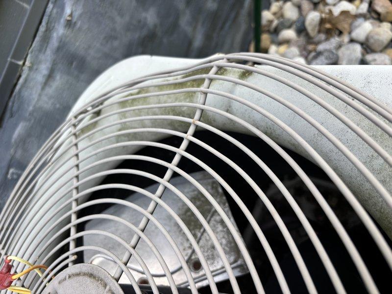 Completed annual cooling system maintenance on 16-year-old residential outdoor condensing unit. Performed comprehensive tune-up inspection including visual assessment of condenser coil, fan assembly, electrical components, and overall unit condition. Unit exhibited normal weathering consistent with age, including dirt accumulation on fan grille, minor algae growth on protective cage, and debris on condenser coil surfaces. All components operational and system ready for cooling season.