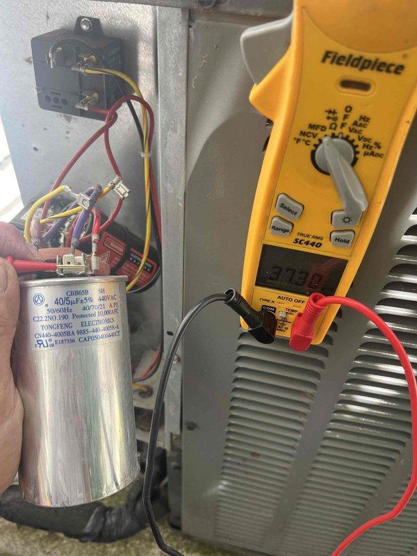 Completed annual cooling maintenance on 2018 EnergiAir system under warranty coverage through September 2026. Performed comprehensive tune-up including electrical diagnostics with amp draw readings at 6.719A, inspected and tested 440V dual-run capacitor showing proper specifications, verified all wire connections at compressor and control board, and documented equipment condition with photos. All components operating within normal parameters; system ready for cooling season.