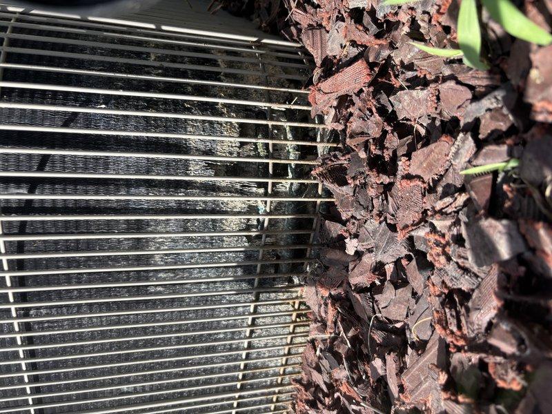 Completed annual cooling maintenance on residential air conditioning system over 10 years old. Removed significant accumulation of leaves and organic debris from condenser coil fins that was restricting airflow and reducing system efficiency. Performed refrigerant charge verification using electronic charging equipment to ensure proper system operation.