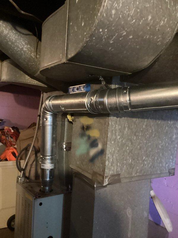 Installed a 40-gallon natural gas water heater with proper venting including B-vent connection to both the furnace and water heater. Replaced existing copper gas line with black pipe from the main supply to the water heater to meet current code requirements. Installed a 5-inch chimney liner to ensure safe exhaust ventilation for the system.