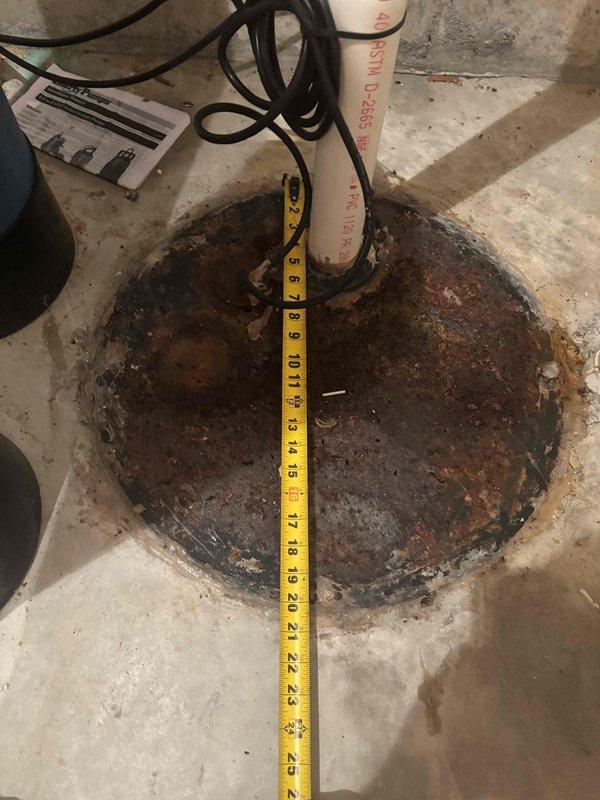 Responded to a three-day ongoing plumbing backup affecting the basement and mechanical room at multiple locations. Upon arrival, assessed the drainage system and identified a severely corroded floor drain basin with extensive rust and deterioration. The metal drain cover and basin showed significant oxidation with brown, orange, and reddish-brown corrosion throughout, compromising the integrity of the drainage fixture. Documented the condition of the existing drain infrastructure, including the PVC drain piping and surrounding concrete floor area which exhibited staining and water damage consistent with repeated backup events. Measured and photographed the corroded drain assembly to document the extent of deterioration for warranty purposes. The backup issue was attributed to the compromised drain system components requiring replacement to restore proper drainage function and prevent future occurrences.