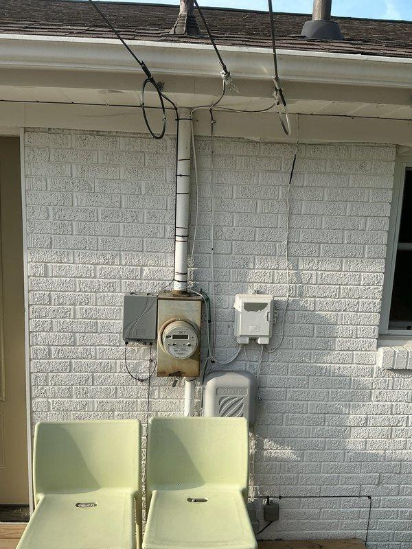 Conducted site assessment for Level 2 electric vehicle charging outlet installation at residential property. Evaluated existing electrical service capacity at exterior meter location and inspected main breaker panel in basement to determine available amperage and circuit breaker space for dedicated EV charging circuit. Documented current electrical infrastructure including service entrance equipment, panel configuration, and potential conduit routing paths to support customer quote preparation for EV charger installation.
