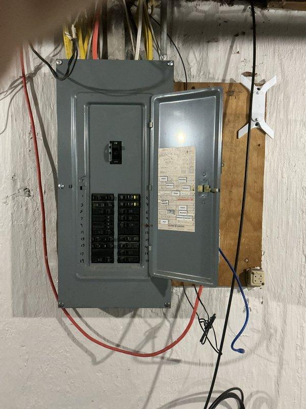 Conducted site assessment for Level 2 electric vehicle charging outlet installation at residential property. Evaluated existing electrical service capacity at exterior meter location and inspected main breaker panel in basement to determine available amperage and circuit breaker space for dedicated EV charging circuit. Documented current electrical infrastructure including service entrance equipment, panel configuration, and potential conduit routing paths to support customer quote preparation for EV charger installation.