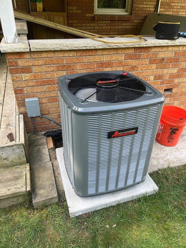 Completed full residential air conditioning system replacement including outdoor condenser unit and indoor air handler integration with existing furnace system. Installed new condenser on concrete pad with proper electrical disconnect, refrigerant line connections, and condensate drainage. Connected indoor components with copper refrigerant lines, integrated PVC venting, and verified all electrical connections to ensure proper system operation and code compliance.
