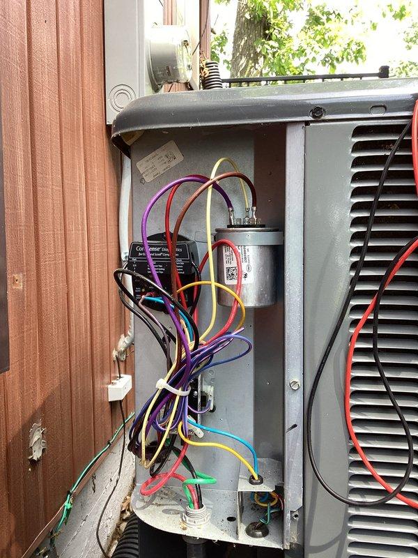 Completed annual cooling maintenance on residential air conditioning system. Accessed unit using provided garage code as customer was not home. Performed comprehensive inspection of outdoor condensing unit, including electrical panel access to evaluate capacitor, contactor, and wiring connections. Conducted electrical testing using multimeter to verify proper voltage and amperage readings across all components. Inspected CoreSense monitoring device for proper operation. All electrical connections found secure with no signs of overheating or damage. System operating within manufacturer specifications upon completion of tune-up service.