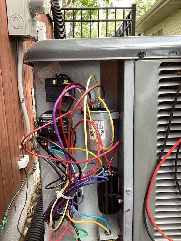 Completed annual cooling maintenance on residential air conditioning system. Accessed unit using provided garage code as customer was not home. Performed comprehensive inspection of outdoor condensing unit, including electrical panel access to evaluate capacitor, contactor, and wiring connections. Conducted electrical testing using multimeter to verify proper voltage and amperage readings across all components. Inspected CoreSense monitoring device for proper operation. All electrical connections found secure with no signs of overheating or damage. System operating within manufacturer specifications upon completion of tune-up service.