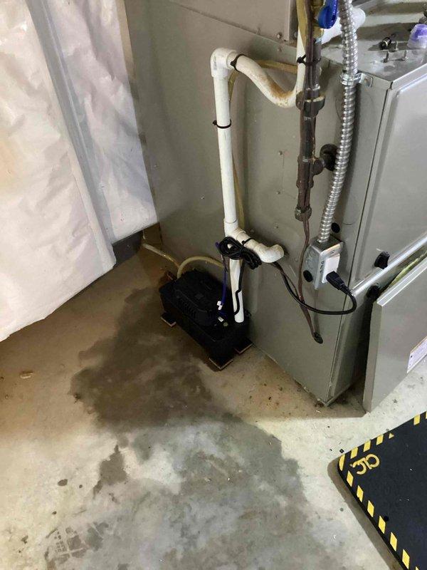 Completed comprehensive AC Super Tune-up on 12-year-old system that was producing abnormal noise. Performed full system inspection, tested all electrical components, cleaned condenser coils, checked refrigerant levels, lubricated moving parts, and tightened all connections. Verified condensate pump operation and drainage system functionality due to visible water staining on basement floor. System restored to optimal operating condition with noise issue resolved.