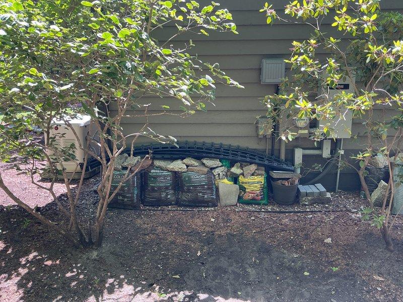 Relocated Generac standby generator unit to new position along side of residence per client request. Generator was disconnected, moved from original location, and reinstalled on prepared gravel pad with proper clearances from structure and adjacent HVAC equipment. Unit was reconnected, tested for proper operation, and site was left clean and organized with landscaping materials staged for completion of surrounding area.