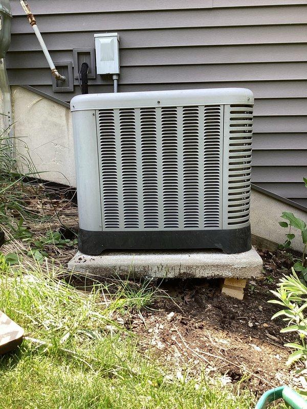 Completed annual cooling maintenance on 11-year-old Ruud air conditioning system. Performed comprehensive tune-up including inspection of condenser unit, verification of refrigerant levels via copper line connections, and assessment of electrical disconnect and conduit system. Noted vegetation overgrowth around condenser unit affecting airflow clearance; recommended customer maintain minimum 24-inch clearance around unit for optimal performance. All system components operating within normal parameters upon completion of service.