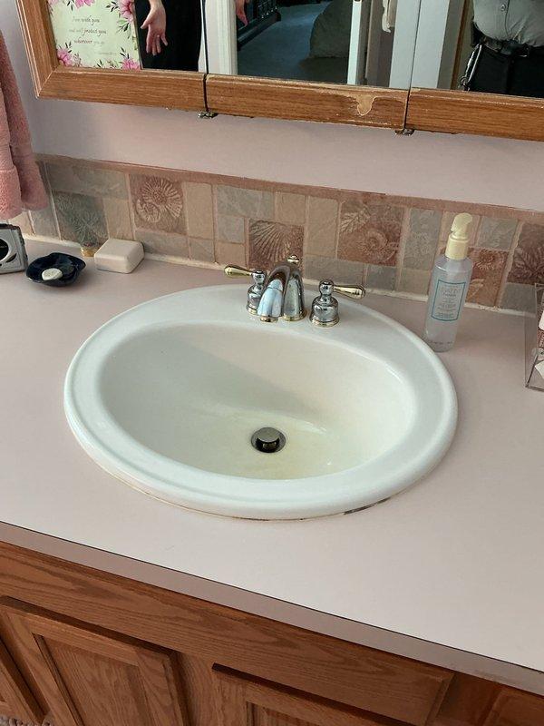 Responded to service call for three leaking faucets in residential bathrooms. Inspected chrome faucets in two separate bathroom vanity areas and identified worn internal components causing the leaks. Replaced deteriorated washers, O-rings, and cartridges as needed on all three fixtures. Tested each faucet for proper operation and verified all leaks were eliminated. Left all fixtures in proper working condition with no active drips or water waste.