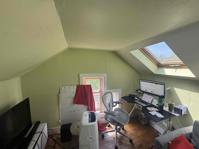 Conducted on-site estimate for Quilt mini-split system installation in converted attic workspace with sloped ceilings, skylight, and home office setup. Assessed exterior wall penetration requirements and evaluated existing utility infrastructure including electrical service location for proper system placement and installation planning.