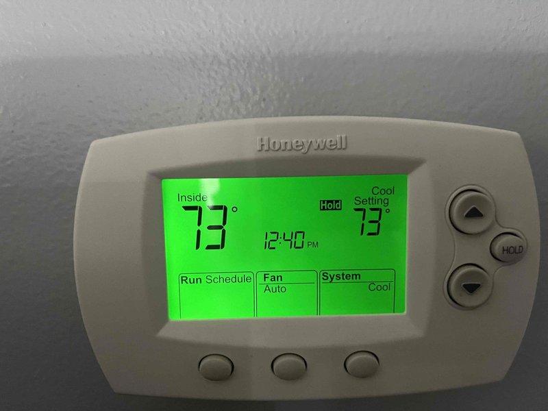 Completed annual cooling maintenance on 2014 Nordyne air conditioning system. Performed standard tune-up procedures including refrigerant pressure testing with manifold gauges, system performance verification, and thermostat operation check. Unit operating properly with thermostat maintaining set point of 73° in cooling mode with fan set to auto.