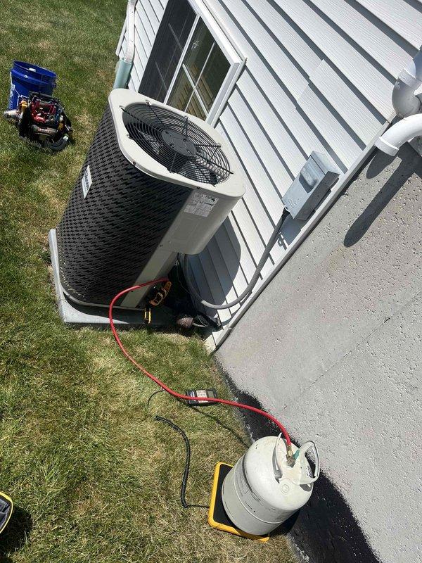 Completed annual cooling maintenance on 2014 Nordyne air conditioning system. Performed standard tune-up procedures including refrigerant pressure testing with manifold gauges, system performance verification, and thermostat operation check. Unit operating properly with thermostat maintaining set point of 73° in cooling mode with fan set to auto.