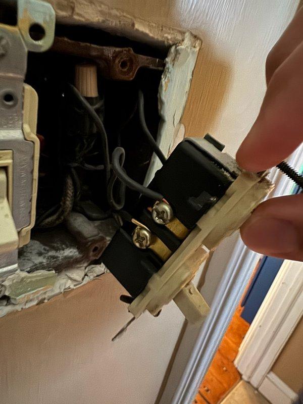 Replaced defective combination switch/outlet device in 130-year-old home. Removed existing wall plate to access electrical box, disconnected worn receptacle, and installed new combination device with proper wire terminations to black, white, and ground conductors. Verified secure connections, tested switch and outlet functionality, and reinstalled cover plate to restore full electrical service to affected area.
