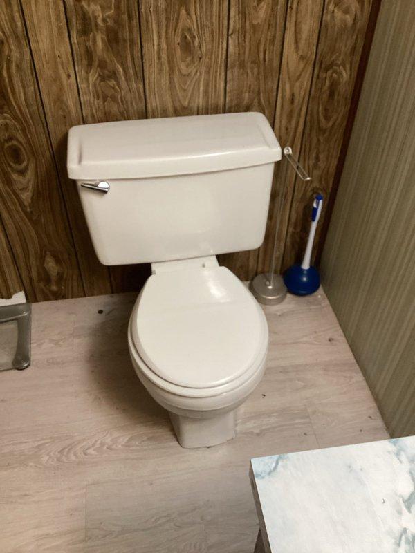 Responded to service call for loose toilet and shower leak. Secured toilet to floor flange by tightening closet bolts and replacing wax ring to ensure proper seal and stability. Inspected shower fixture and tub spout assembly for source of leak. Tightened escutcheon plate connections and tested water flow at shower control valve. Verified all connections at tub spout and drain assembly for proper sealing. Confirmed no active leaks present at toilet base after repairs. All fixtures tested and operating properly upon completion.