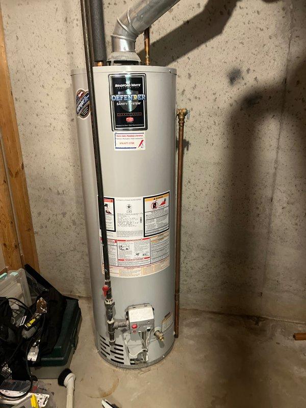 Completed annual cooling maintenance on residential air conditioning system. Performed standard tune-up procedures including filter inspection, refrigerant level check, electrical connection testing, and condenser coil cleaning. All system components operating within manufacturer specifications at time of service.

Inspected existing Bradford White Defender Safety System water heater in basement utility area per customer request for replacement quote. Unit shows age-related wear with visible corrosion on plumbing connections and mineral deposits on tank surface. Documented current installation configuration including copper supply lines, gas connections, and exhaust venting system. Photographed existing equipment and surrounding infrastructure to provide accurate replacement estimate for new water heater installation.