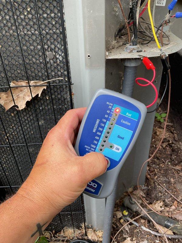 # No Cool Service Call - Lennox AC System

Responded to no cooling complaint affecting entire residence with 17-year-old Lennox air conditioning system. Upon arrival, customer was not home but access was available. Performed diagnostic testing on outdoor condensing unit using electronic capacitor analyzer.

Inspection revealed failed dual-run capacitor (TITAN PRO TRCFD3010, 80+10 MFD/370V) with visible damage including burnt and frayed wire connections at terminals. Capacitor showed signs of significant deterioration with compromised wire insulation on red, blue, and black leads. This component failure prevented compressor and condenser fan operation, resulting in complete system shutdown and loss of cooling.

Replaced defective capacitor with new dual-run capacitor meeting manufacturer specifications. Secured all electrical connections with proper terminals, ensuring tight connections on common, fan, and compressor terminals. Verified proper wire routing and insulation integrity. Cycl
