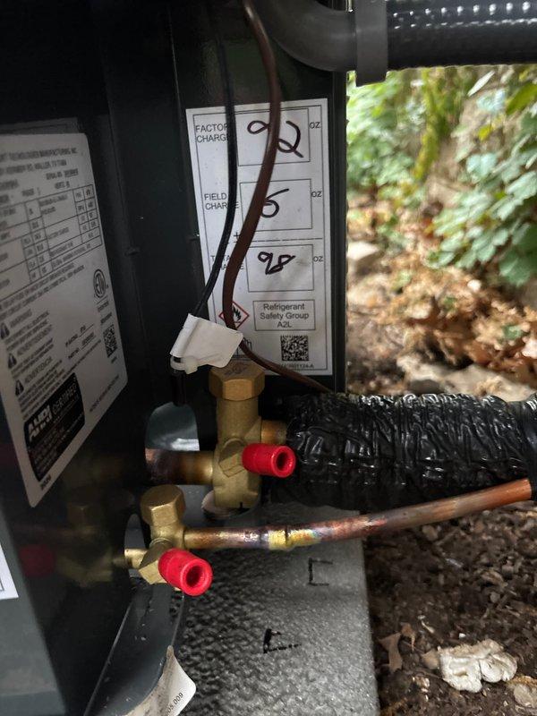 Complete air conditioning system replacement performed during scheduled appointment. Removed existing outdoor condensing unit and installed new equipment with proper refrigerant charge per factory specifications. Verified factory charge label and refrigerant safety documentation on new unit. Connected electrical wiring to condensing unit with proper terminations and secured all line set connections with appropriate valve fittings and protective caps. Completed copper line set installation with brazed joints connecting outdoor unit to indoor air handler. Secured refrigerant lines and condensate piping to ceiling joists in basement area using appropriate hangers and supports. Tested all electrical connections, verified proper voltage supply, and confirmed system operation. System commissioned successfully with all components functioning within manufacturer specifications.