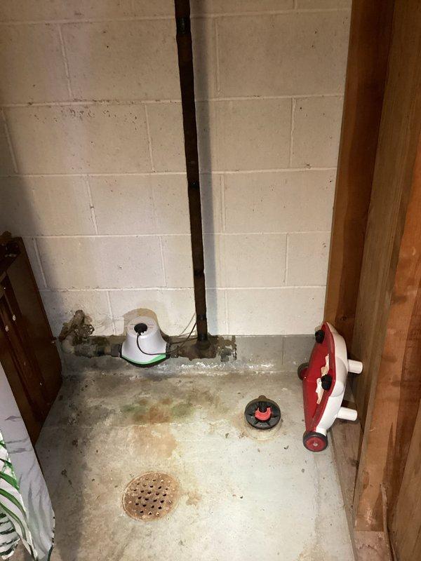 Responded to routine maintenance call for main sewer line concern in 76-year-old residential property. Performed thorough inspection of basement plumbing infrastructure, including vertical drain stack in laundry room area and floor drain system. Assessed condition of main line connections, drainage points, and associated plumbing fixtures. Documented existing conditions with photographs showing utility room plumbing configuration and basement floor drain location. All accessible drain lines and connections were evaluated for proper function and flow.