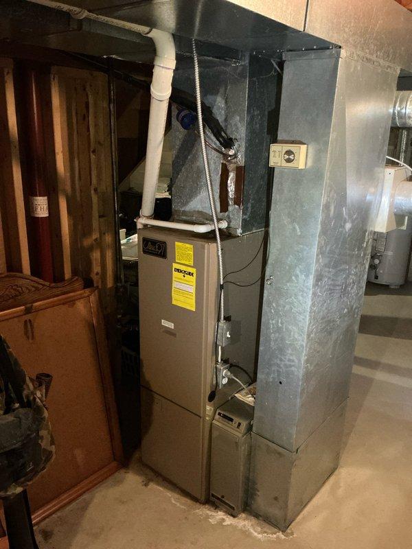 Performed comprehensive evaluation of residential air conditioning system experiencing inadequate cooling throughout home. Unit confirmed to be 12 years old with documented refrigerant leak from previous service visit earlier this year. System demonstrated significantly reduced cooling capacity despite thermostat settings well below ambient temperature. Inspected outdoor condensing unit and indoor air handler installation, documented equipment condition through photography, and assessed overall system performance. Provided estimate for AC replacement due to age of equipment, existing refrigerant leak, and diminished cooling efficiency.