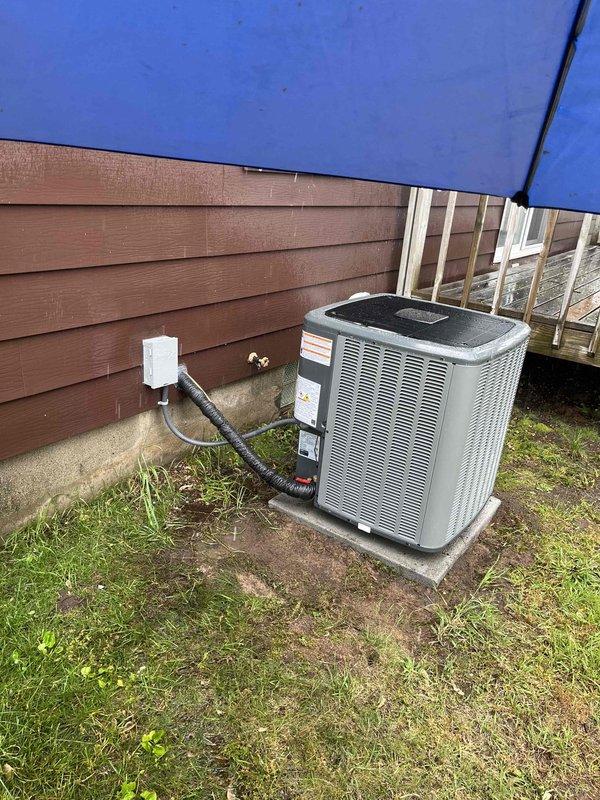 Completed full HVAC system installation including new furnace and air conditioning condenser unit. Installed outdoor AC unit on concrete pad with proper leveling, connected refrigerant lines and electrical service including disconnect box mounted to exterior wall. Routed conduit and wiring per code requirements, established all electrical connections, and verified proper operation of complete heating and cooling system.