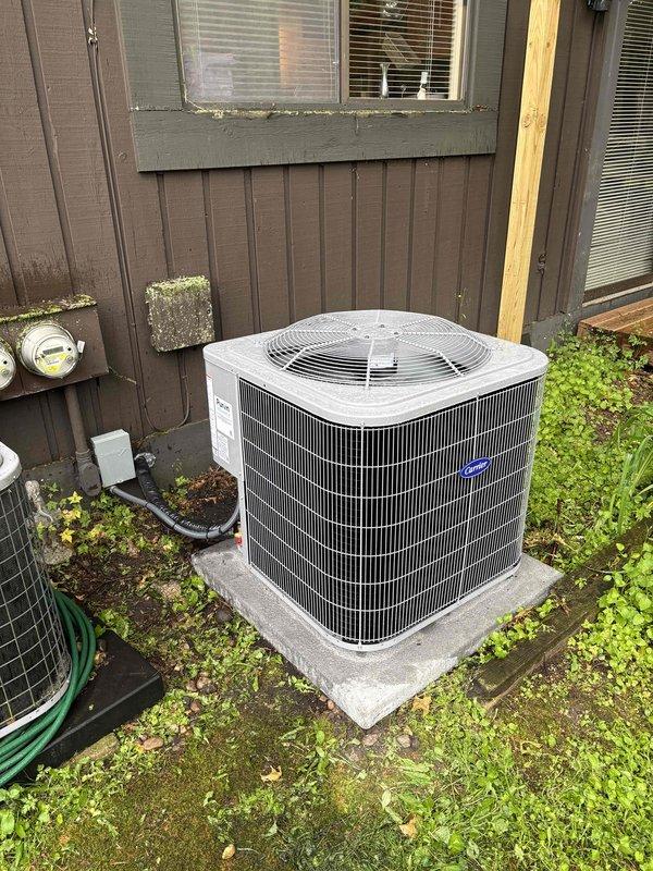 Completed full air conditioning system replacement including outdoor condensing unit and indoor air handler components. Installed new Carrier brand outdoor unit on existing concrete pad with proper refrigerant line connections and electrical hookup. Replaced indoor furnace and air handler assembly with new equipment, installed metallic supply ductwork with reflective insulation, and integrated flexible condensate drainage lines. Verified all electrical connections at meter and control panels, tested system operation for proper cooling cycle, and confirmed adequate airflow through new pleated filter media.