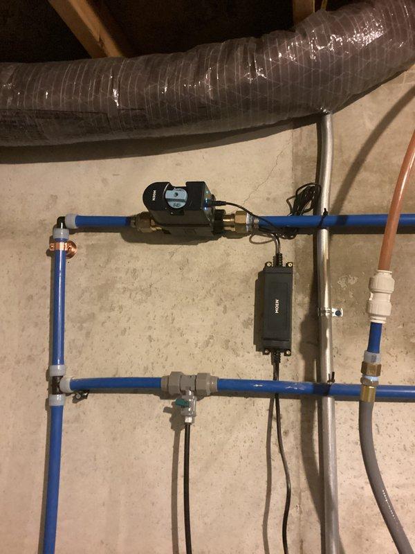 Installed client-provided bathroom vanity and client-supplied shut-off valves in a 5-hour service call. The installation included connecting the vanity to existing PEX plumbing infrastructure with brass fittings and ball valves, ensuring proper water supply integration with the home's water treatment system and expansion tank configuration.