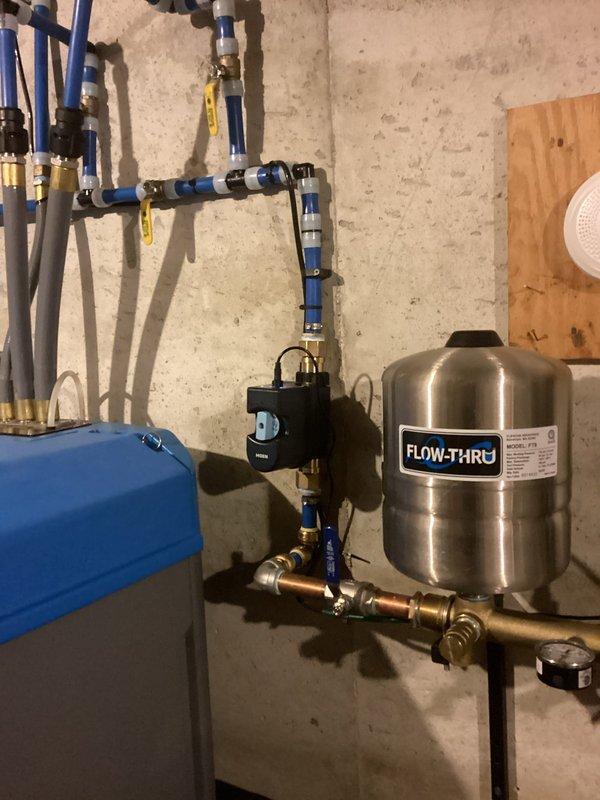Installed client-provided bathroom vanity and client-supplied shut-off valves in a 5-hour service call. The installation included connecting the vanity to existing PEX plumbing infrastructure with brass fittings and ball valves, ensuring proper water supply integration with the home's water treatment system and expansion tank configuration.