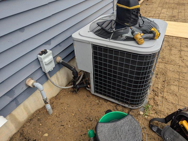 Responded to service call to temporarily disconnect and relocate 12-year-old Heil air conditioning system to allow for concrete pouring around the unit. Disconnected electrical power at outdoor disconnect box and safely capped all electrical connections. Recovered refrigerant from the system in accordance with EPA regulations. Disconnected refrigerant lines at the condenser unit and properly sealed line sets to prevent contamination. Removed condensate drain line connections. Lifted and relocated the condenser unit from its existing concrete pad to a safe staging area away from the work zone. Protected all copper refrigerant lines, electrical wiring, and PVC condensate piping during the relocation process. Secured all disconnected components and provided instructions for reconnection once concrete work is completed. Unit is ready for reinstallation following completion of concrete pad replacement.