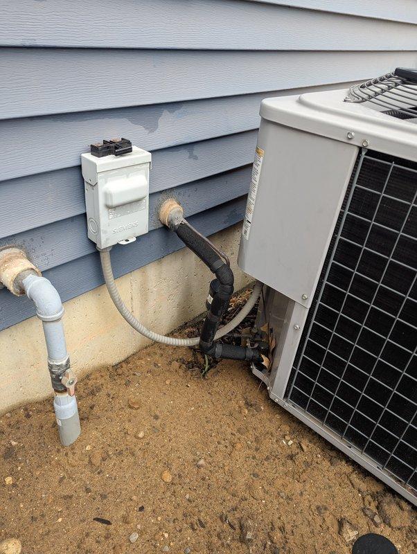 Responded to service call to temporarily disconnect and relocate 12-year-old Heil air conditioning system to allow for concrete pouring around the unit. Disconnected electrical power at outdoor disconnect box and safely capped all electrical connections. Recovered refrigerant from the system in accordance with EPA regulations. Disconnected refrigerant lines at the condenser unit and properly sealed line sets to prevent contamination. Removed condensate drain line connections. Lifted and relocated the condenser unit from its existing concrete pad to a safe staging area away from the work zone. Protected all copper refrigerant lines, electrical wiring, and PVC condensate piping during the relocation process. Secured all disconnected components and provided instructions for reconnection once concrete work is completed. Unit is ready for reinstallation following completion of concrete pad replacement.