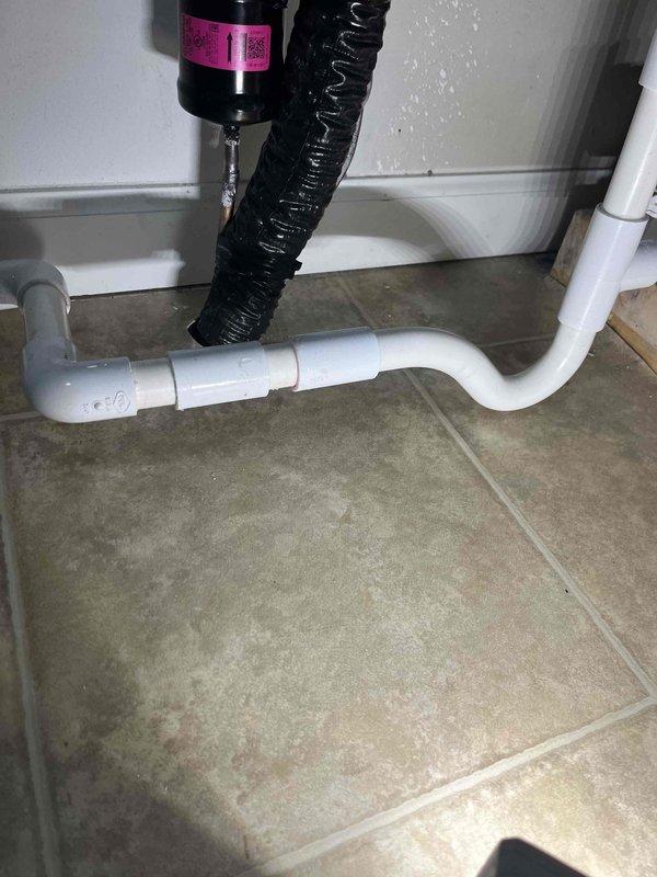 Responded to no cooling complaint on newly installed unit with reported leak. Upon inspection, identified water discharge issue at condensate drain system. Examined drain line configuration and P-trap assembly beneath air handler. Found improper drainage setup causing water accumulation. Verified condensate drain line connections, secured fittings, and ensured proper trap installation to prevent airflow issues and facilitate correct water evacuation. System tested and confirmed proper condensate removal with no further leaking observed.