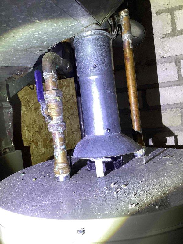 Responded to water heater service call and performed system inspection. Confirmed proper installation of expansion tank and associated copper piping connections. Verified water heater tank condition, pressure relief valve operation, and all plumbing connections for leaks or defects. System found to be functioning within normal parameters with expansion tank properly mounted and secured to prevent thermal expansion issues.