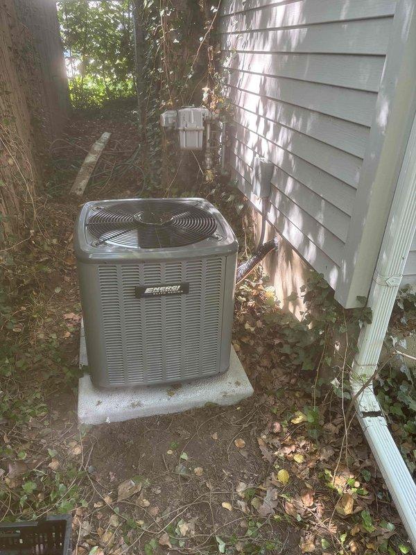 Completed full air conditioning system replacement at residential property. Installed new outdoor condensing unit on existing concrete pad adjacent to house with white siding. Unit positioned near electrical meter with proper clearances maintained. Ran and insulated new copper refrigerant line set with black insulation wrap, connecting outdoor unit to indoor air handler. Installed brass service valves with protective caps on both liquid and suction lines for future service access. Charged system with refrigerant per manufacturer specifications, documenting field charge of 6 lbs and total system charge of 534 oz. Verified all connections properly brazed and insulated. System tested and operational upon completion. All work performed in accordance with industry standards and local codes. Financing documentation processed through Michigan Saves program for project approval.