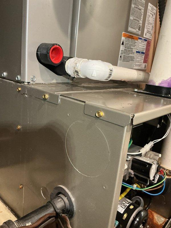 Responded to no cooling complaint on five-year-old Payne system with condenser freezing issues. Upon inspection, discovered significant rust corrosion on evaporator coil drain pan and evidence of restricted airflow. Identified compromised condensate drainage system with visible corrosion affecting system performance. Inspected air handler cabinet, blower assembly, and electrical connections. Documented extensive rust damage on internal components and evaluated overall system condition. Advised customer of findings and provided recommendations for necessary repairs to restore proper cooling operation and prevent further component deterioration.