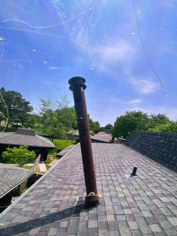 Completed annual cooling maintenance on 11-year-old ICP system. Performed standard tune-up procedures including inspection of all components, cleaning, and system testing. Per customer request, inspected stacked vent pipe on roof. Found vent penetration showing signs of age with rust discoloration and weathering on metal flue collar and cap. Vent flashing and roof penetration seal appear intact with no immediate concerns. Documented condition with photos from interior attic space and exterior rooftop for customer records. System operating within normal parameters.