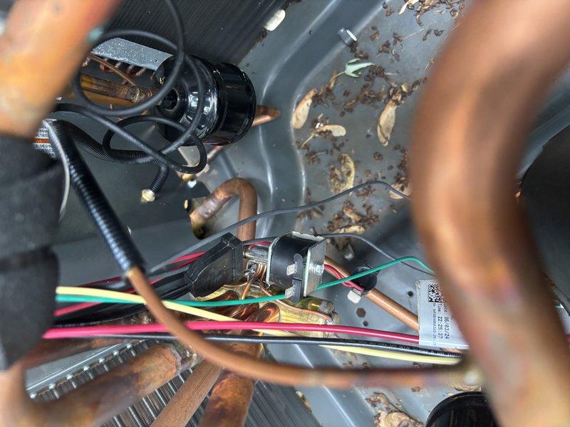 Responded to no cooling complaint where system was heating instead of cooling. Upon inspection, found corroded electrical connections and deteriorated wiring within the air handler enclosure. Accessed control board (model HCS 2223) and identified reversing valve circuit malfunction causing system to operate in heat mode. Repaired faulty terminal connections, cleaned corroded contacts, and tested all electrical connections for proper voltage and continuity. Cycled system through cooling mode to verify proper operation and confirmed unit now cooling as designed.