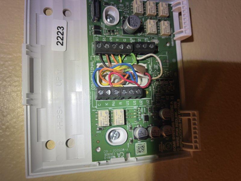 Responded to no cooling complaint where system was heating instead of cooling. Upon inspection, found corroded electrical connections and deteriorated wiring within the air handler enclosure. Accessed control board (model HCS 2223) and identified reversing valve circuit malfunction causing system to operate in heat mode. Repaired faulty terminal connections, cleaned corroded contacts, and tested all electrical connections for proper voltage and continuity. Cycled system through cooling mode to verify proper operation and confirmed unit now cooling as designed.