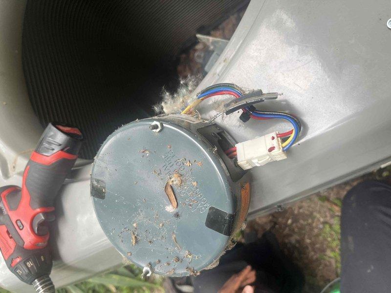 Responded to no cooling complaint on 6-year-old Luxaire system that was short cycling after one minute of operation. Upon inspection, found condenser fan motor heavily contaminated with lint and debris accumulation, causing motor overheating and thermal shutdown. Removed failed motor, documented condition with photographs, and replaced with new motor assembly. Verified proper electrical connections, tested system operation, and confirmed unit running normally with adequate cooling performance.