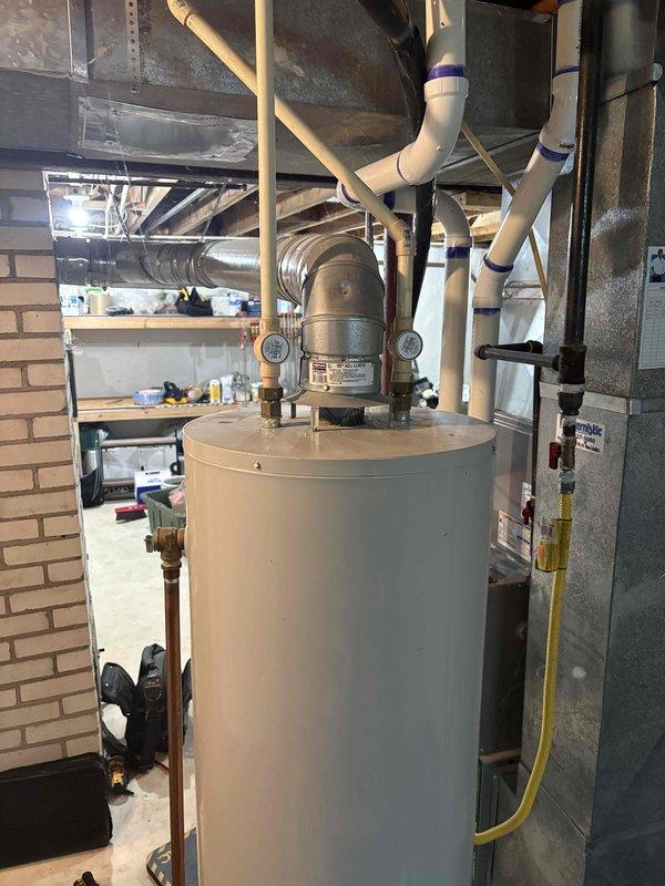 Responded to water heater pilot light issue on 10-year-old Bradford unit. Customer had previously removed and cleaned burner assembly, achieving ignition, but reported pilot tube running excessively hot. Inspected burner assembly, pilot assembly, and thermocouple connections. Evaluated gas control valve operation due to abnormal pilot tube temperature, which indicated potential valve malfunction affecting gas flow regulation. Documented equipment condition and advised on potential gas control valve replacement to resolve overheating pilot tube concern.