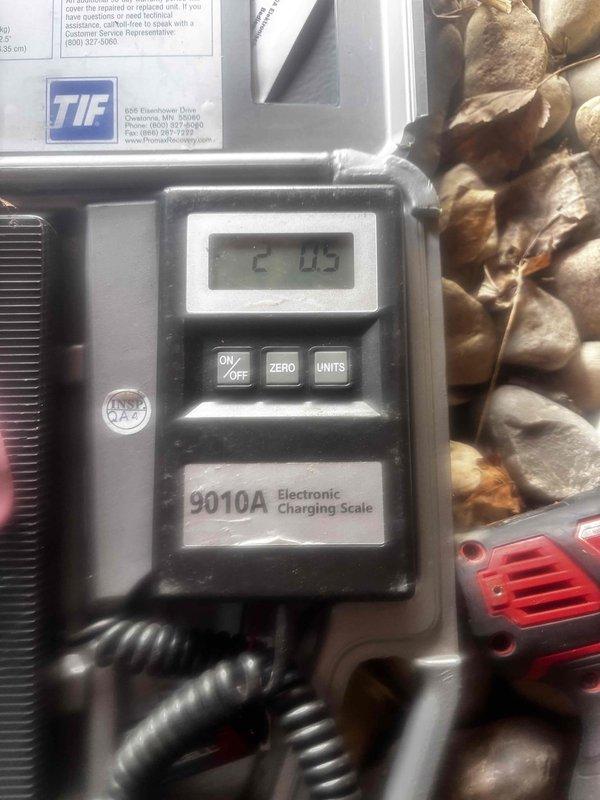 Responded to no cooling complaint on 6-year-old Heil air conditioning system. Upon inspection, found system low on refrigerant charge. Used electronic charging scale to measure and add refrigerant to manufacturer specifications, bringing charge to proper level of 2.05 pounds. Verified system operation and confirmed unit now cooling to setpoint temperature.