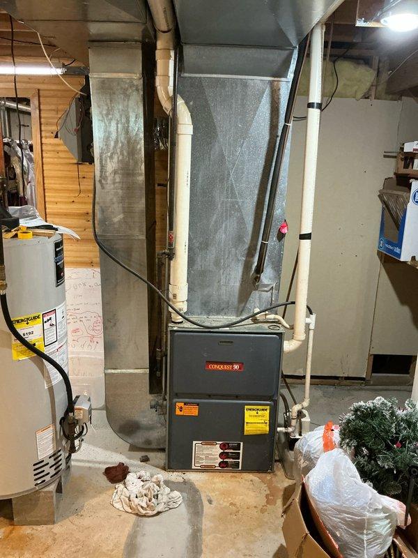 Completed estimate for furnace and air conditioning system replacement at residential property. Existing Goodman furnace and AC system evaluated in basement mechanical room, with air conditioning unit confirmed as non-operational. Documented current equipment configuration including ductwork layout, electrical connections, and installation conditions to provide comprehensive replacement proposal for new HVAC system.