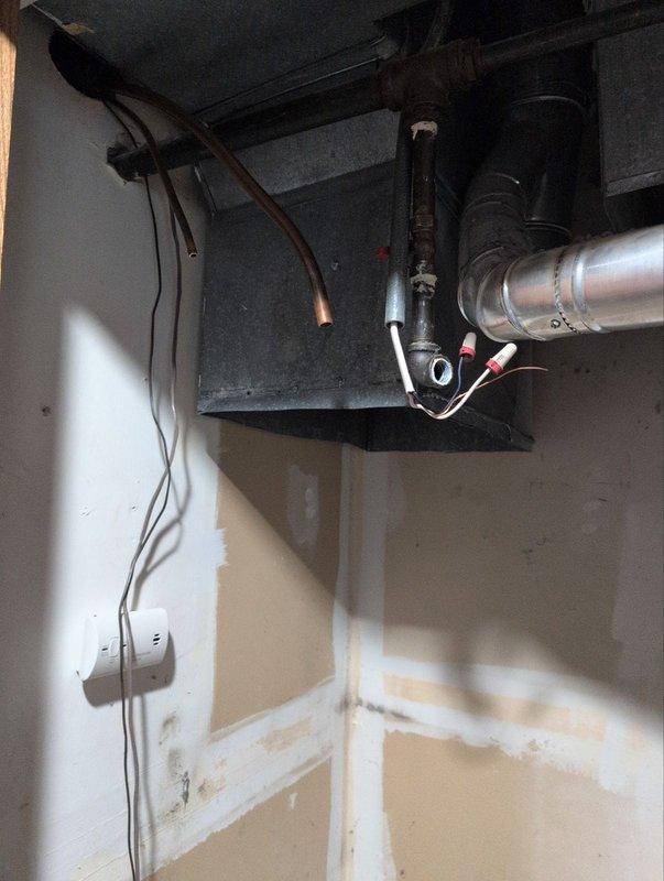 Completed removal of residential furnace and air conditioning system from utility closet as part of under one-year test drive program. Disconnected and extracted HVAC equipment, including ductwork connections, electrical wiring, and associated mechanical components. Documented pre-removal conditions showing water heater proximity, existing ductwork configuration, and utility closet layout for future reference.