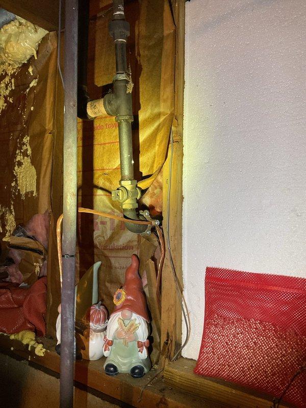 Replaced corroded 12-inch gas pipe section connecting the meter to the home's interior supply line. The existing galvanized steel pipe exhibited significant rust deterioration and was removed and replaced with new piping to ensure safe gas delivery and prevent potential leaks.