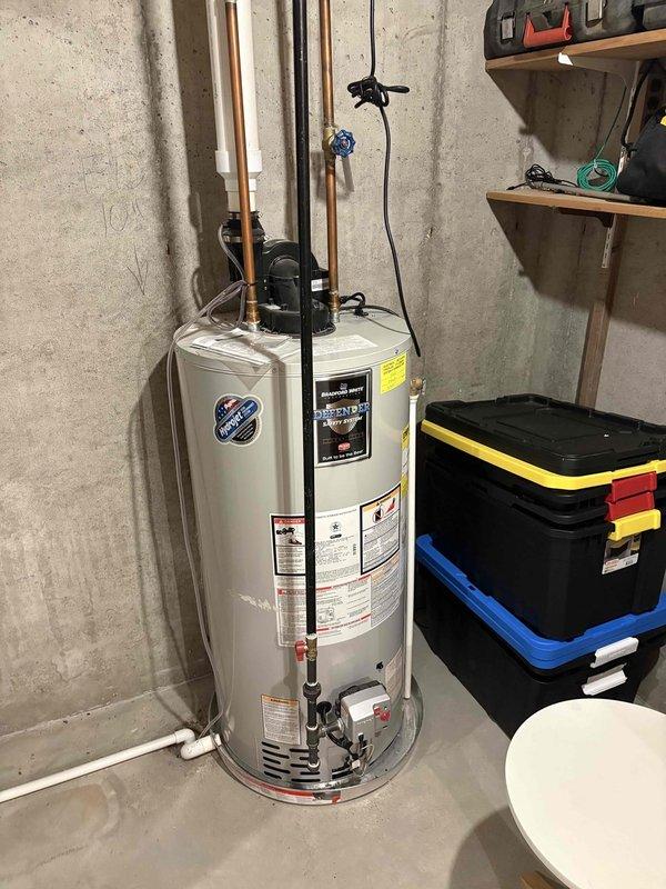 # Cooling System Service Call

Responded to customer complaint of air conditioning system running continuously without achieving adequate cooling. Unit age reported at 15 years. Upon arrival, confirmed thermostat indicated cooling mode and indoor blower motor was operating. Performed diagnostic evaluation of HVAC system located in basement utility area. Inspected condensing unit, refrigerant lines, and air handler components. Checked system pressures, airflow, and electrical connections. Evaluated humidifier integration with ductwork system. Documented equipment condition and installation configuration with photographic evidence. Based on system age and operational symptoms, provided customer with findings and recommended service options to restore proper cooling performance.