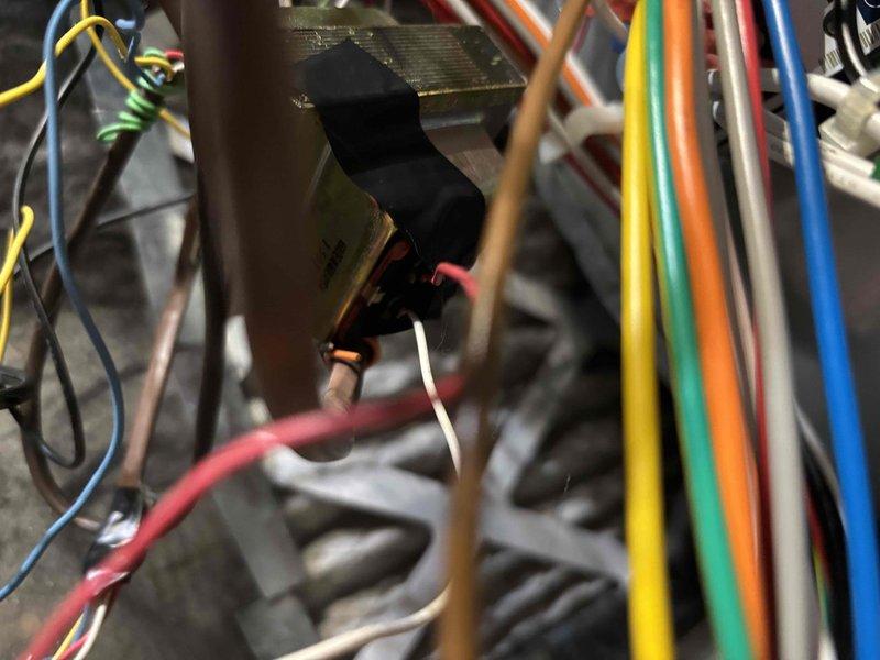 Responded to no cooling call on 2014 residential HVAC system. Upon arrival, confirmed unit was not operating and traced issue to control board and wiring connections within the air handler. Inspected electrical components, circuit board, and wire harnesses for loose connections, damaged wiring, or failed relays that would prevent system operation. Photographed internal wiring configuration and control board assembly for documentation. Identified and resolved electrical connection issue preventing system from receiving proper signal to initiate cooling cycle. Verified all wire connections were secure at control board terminals and tested system operation. Unit restored to normal cooling function with proper airflow and temperature output confirmed.