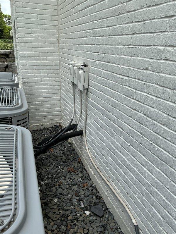 Completed assessment of refrigerant line sets for four air conditioning systems at property. Inspected all exterior condenser units, verified line set routing and mounting along building exterior, and documented current installation conditions with photos. All refrigerant lines and associated PVC pipe covers were examined for proper installation and secure mounting to exterior wall.