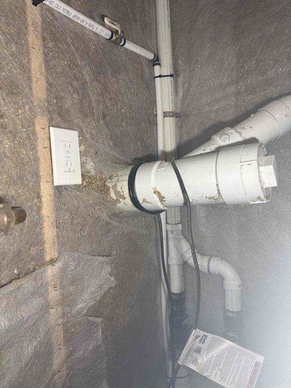 Responded to no hot water call and confirmed water heater was completely non-operational. Upon inspection, determined eight-year-old unit had failed beyond economical repair. Documented existing installation conditions including attic-mounted plumbing configuration with PVC piping system and basement sump pump setup. Customer declined service call and opted to proceed with free water heater replacement estimate instead.